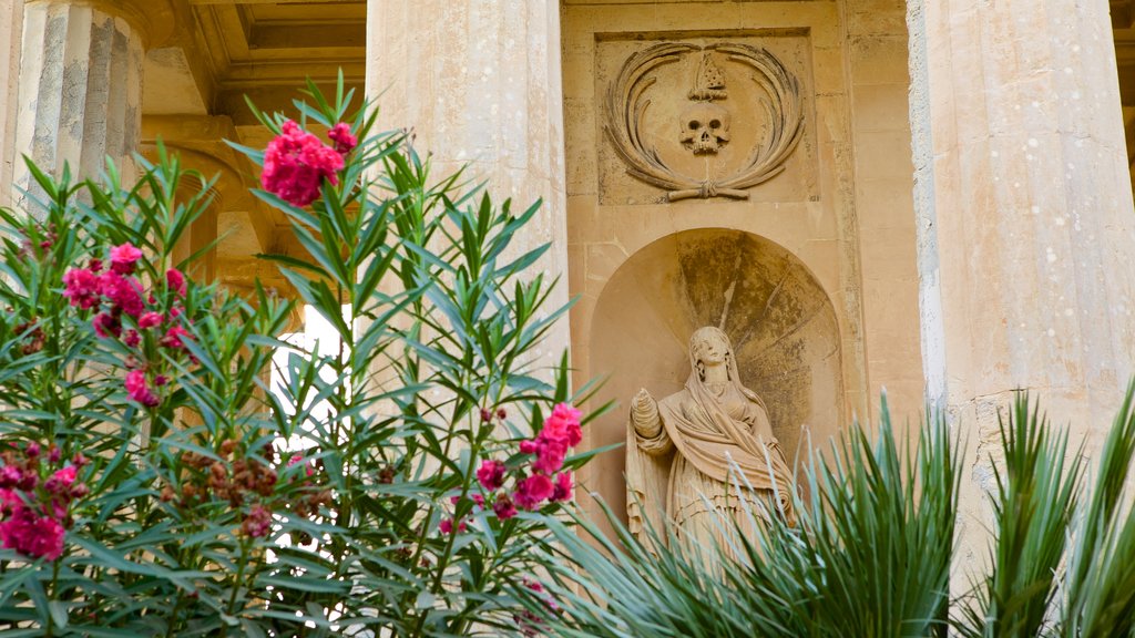 Lower Barrakka Gardens showing flowers, heritage architecture and a garden