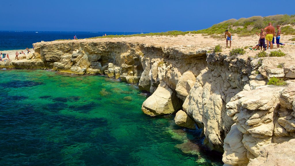 Bugibba Beach showing rocky coastline