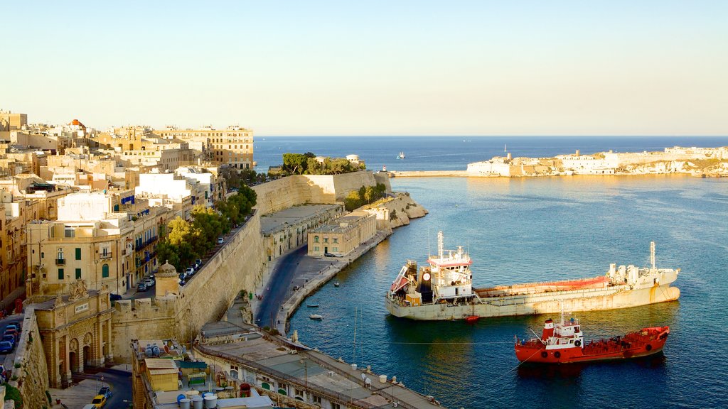 Upper Barrakka Gardens which includes general coastal views, heritage architecture and a bay or harbour