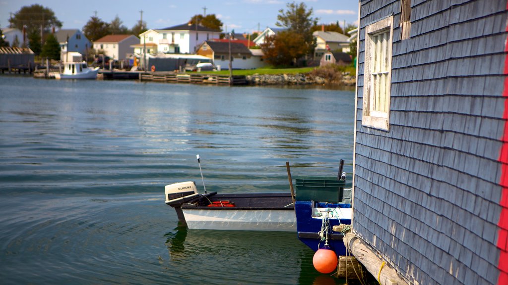 Fisherman\'s Cove featuring a house, a marina and a coastal town