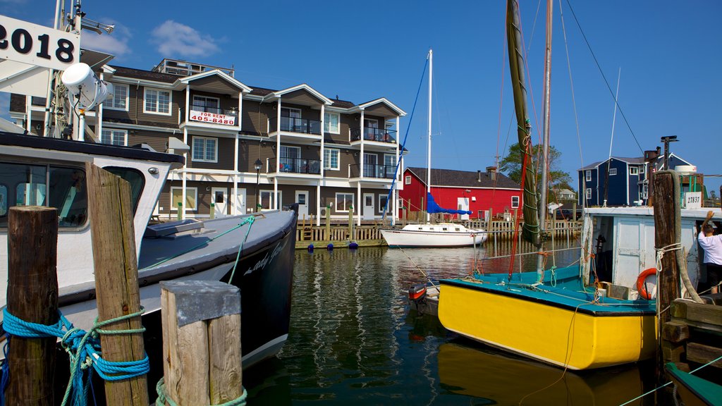 Fisherman\'s Cove which includes a bay or harbour and a house