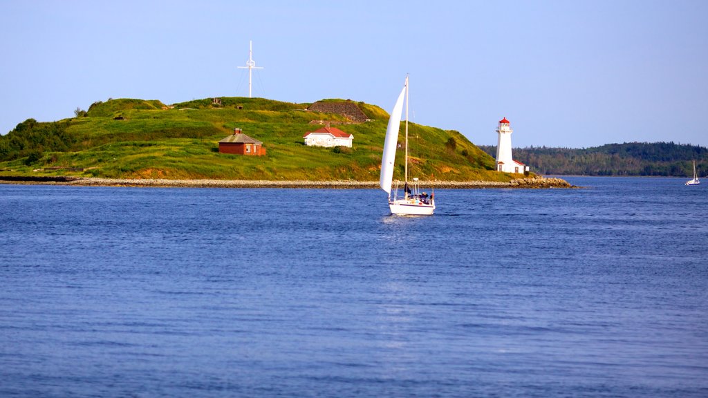 Halifax Waterfront Boardwalk showing sailing, a lighthouse and general coastal views