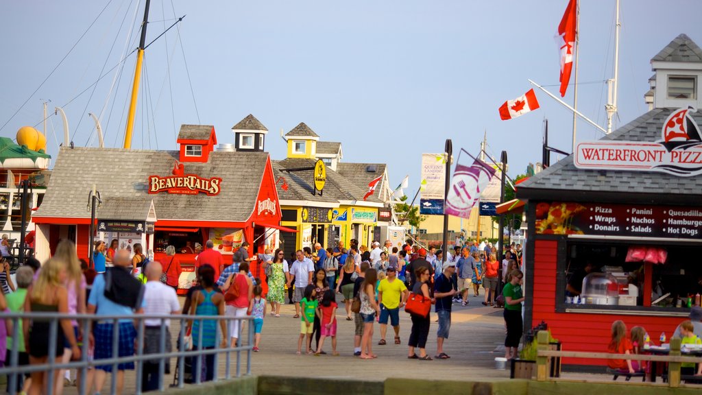 Halifax Waterfront Boardwalk which includes signage, a coastal town and a small town or village