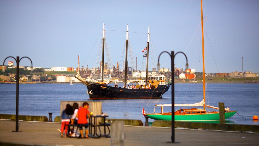 Halifax Waterfront Boardwalk which includes street scenes, general coastal views and a bay or harbour