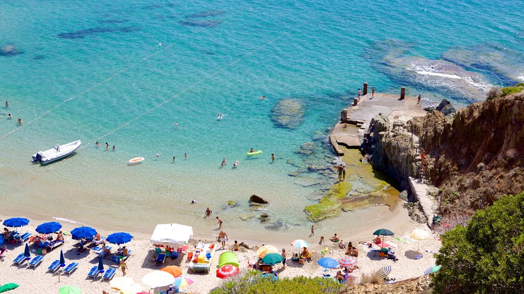 Porto Flavia which includes a sandy beach and swimming