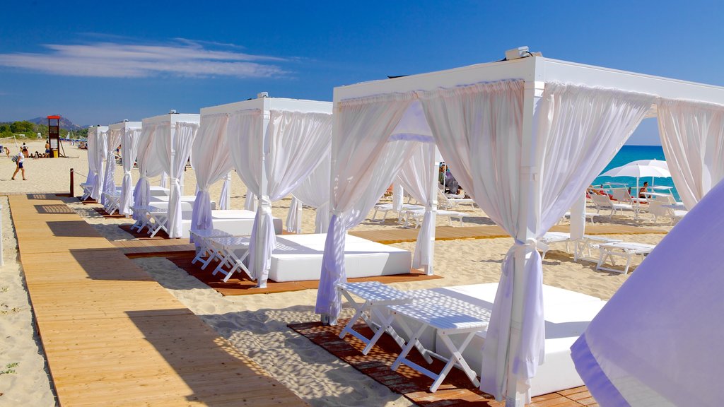 Cala Sinzias featuring a sandy beach