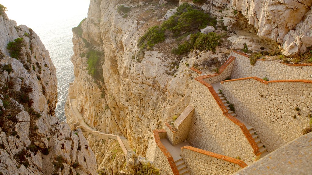 Capo Caccia featuring a gorge or canyon and rugged coastline