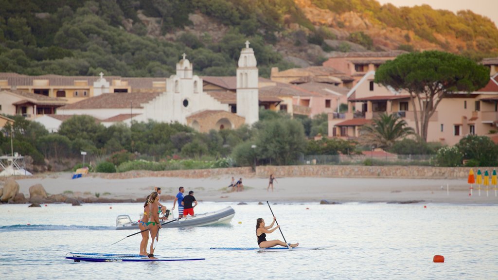 La Marinella Beach showing a coastal town, a sandy beach and general coastal views