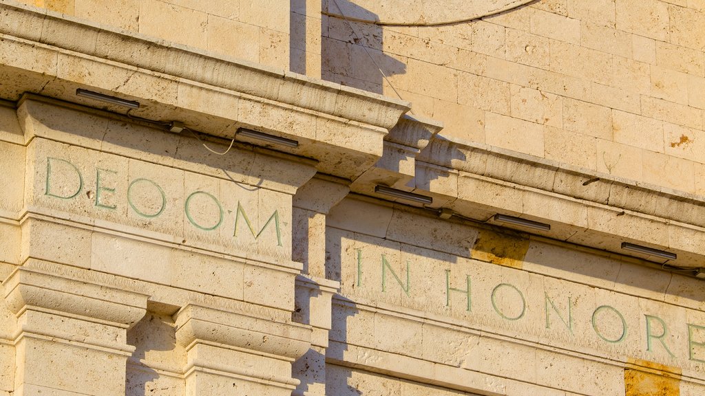 Sanctuary of Our Lady of Bonaria which includes religious aspects, a church or cathedral and signage