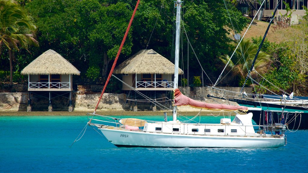 Iririki Island which includes tropical scenes, a bay or harbour and a coastal town