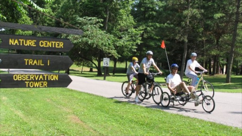 Madison featuring signage, cycling and a garden