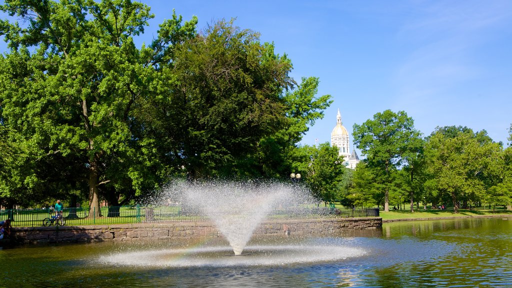 Bushnell Park showing a garden, a fountain and a pond