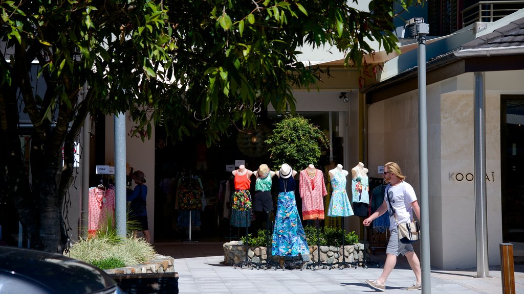 Hastings Street featuring fashion and street scenes as well as an individual male