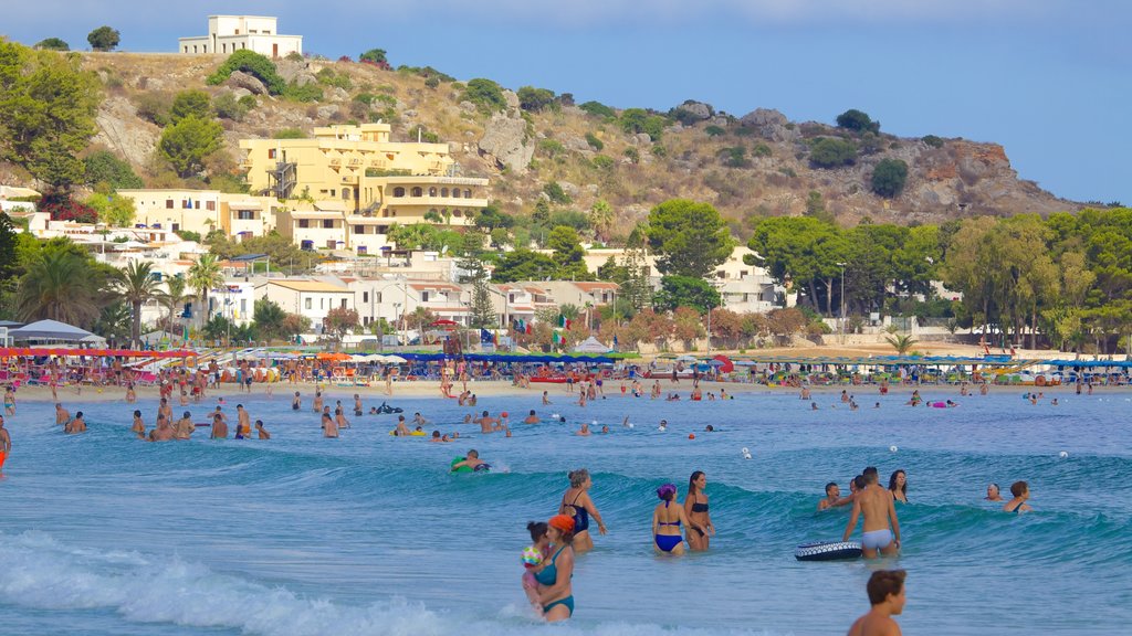 San Vito Lo Capo which includes a coastal town, swimming and general coastal views