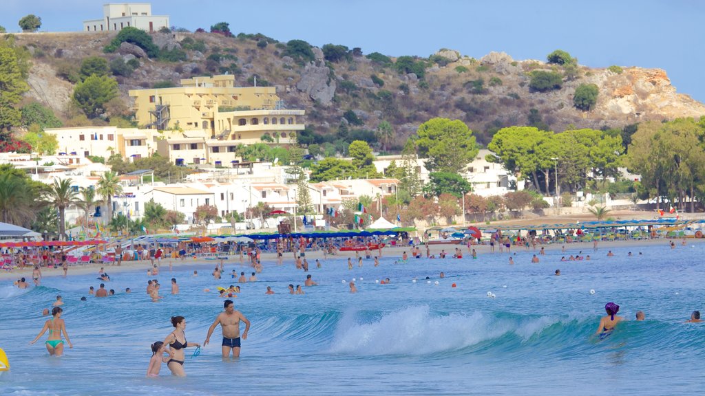 San Vito Lo Capo which includes a coastal town, swimming and general coastal views