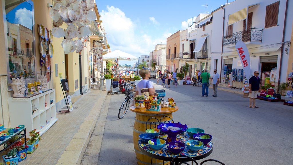 San Vito Lo Capo featuring markets and street scenes as well as a small group of people