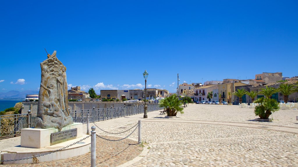 Castellammare del Golfo which includes street scenes and a statue or sculpture