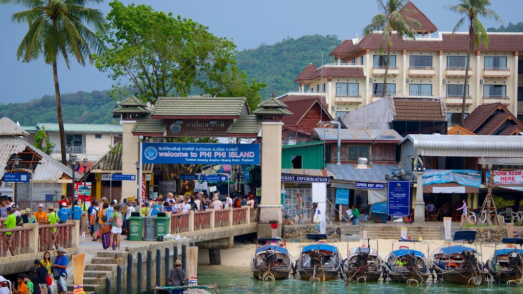 Ko Phi Phi featuring boating and a coastal town as well as a large group of people