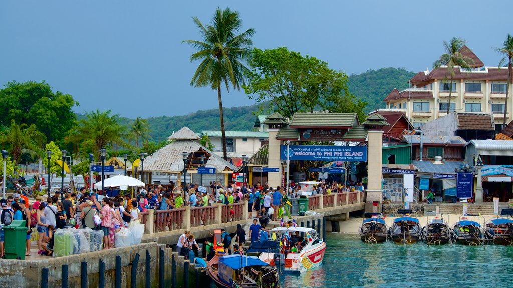 Ao Ton Sai Beach which includes general coastal views and a coastal town as well as a large group of people