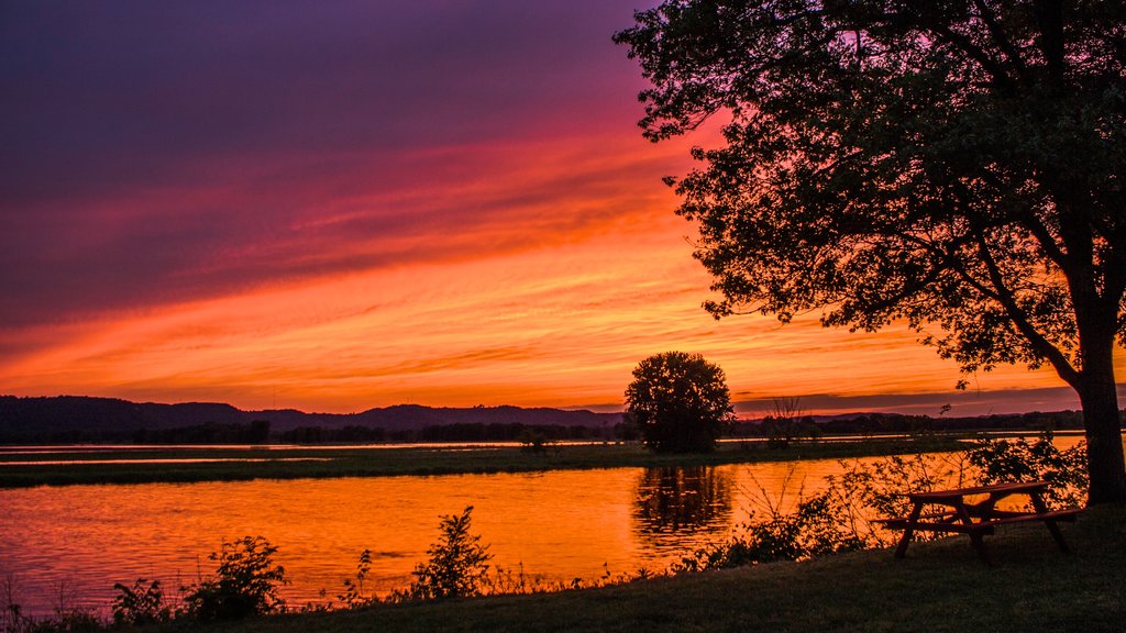 La Crosse showing a sunset and a lake or waterhole