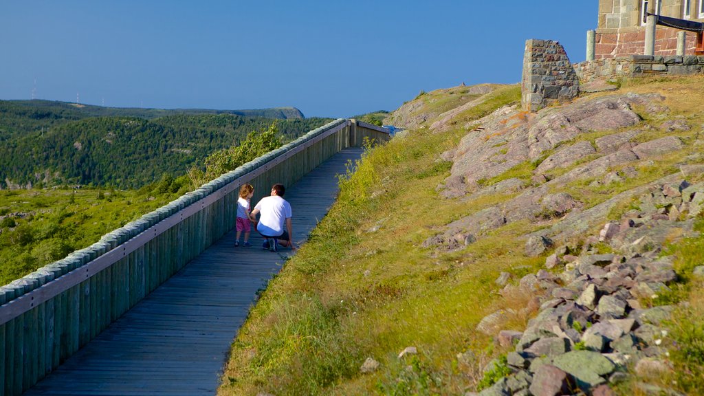 Cabot Tower showing landscape views as well as a family