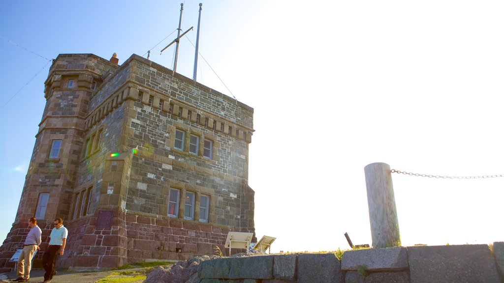 Cabot Tower featuring heritage elements as well as a small group of people