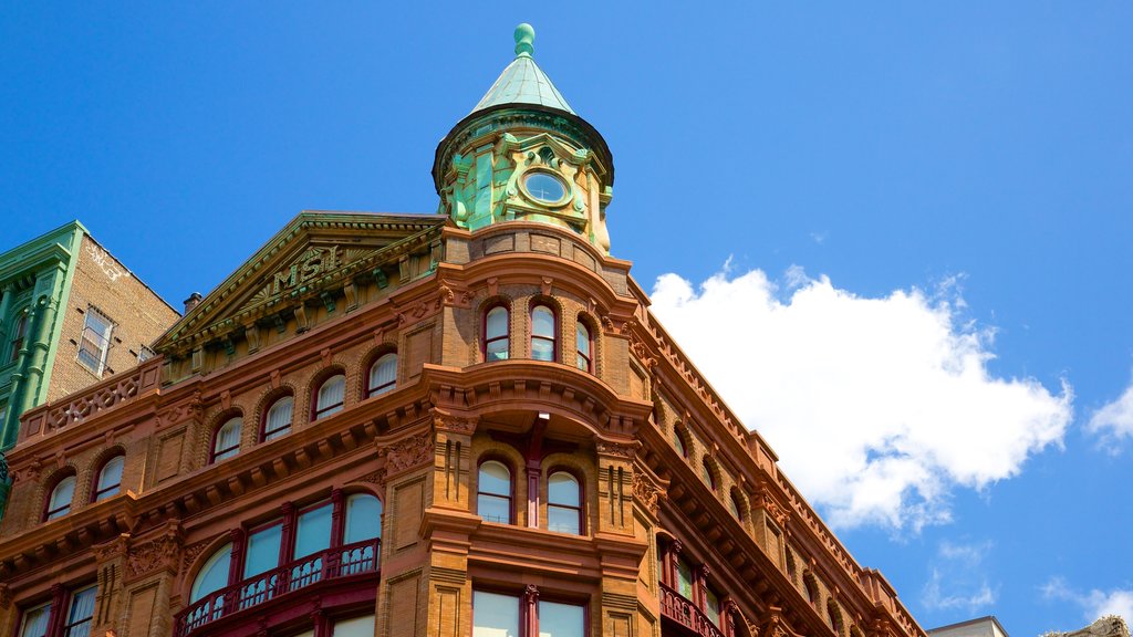 Bleecker Street featuring heritage architecture and a city