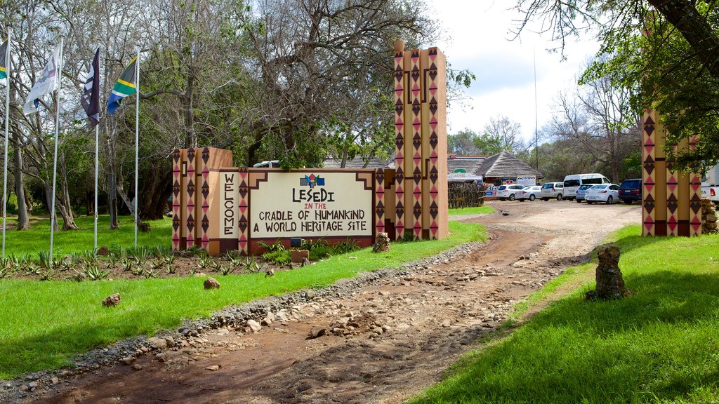 Lesedi Cultural Village featuring signage and a small town or village