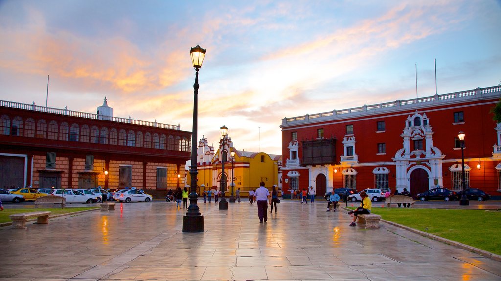 Trujillo Plaza de Armas featuring a square or plaza, a sunset and a city