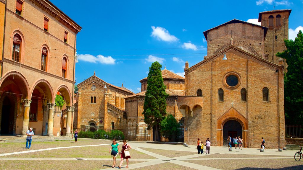 Basilica Santo Stefano showing a square or plaza, a small town or village and heritage architecture