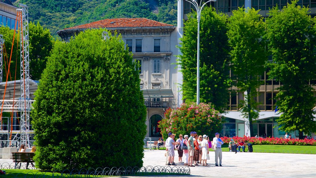 Piazza Cavour showing a square or plaza as well as a small group of people