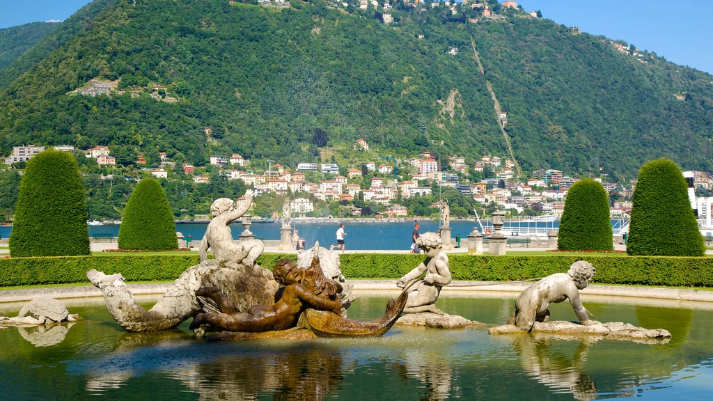 Villa Olmo showing a coastal town, a garden and a statue or sculpture