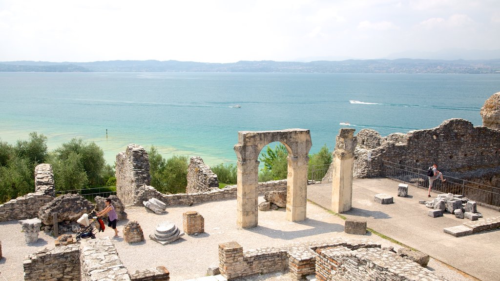 Grotto of Catullus which includes a ruin, heritage elements and general coastal views