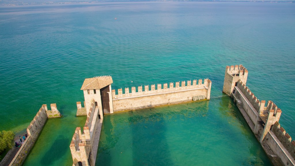 Scaliger Castle showing a lake or waterhole and building ruins