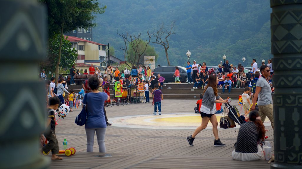 Sun Moon Lake which includes a square or plaza as well as a large group of people