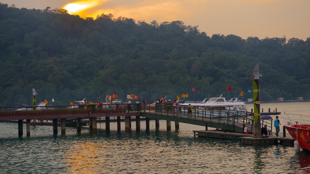 Sun Moon Lake showing a bay or harbour, a sunset and a lake or waterhole