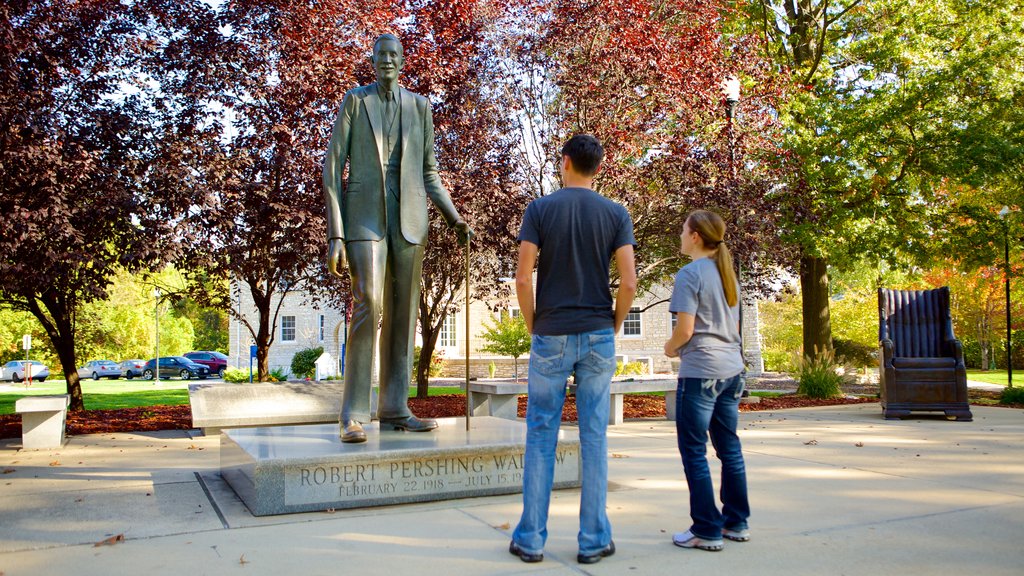 Alton showing a statue or sculpture as well as a couple