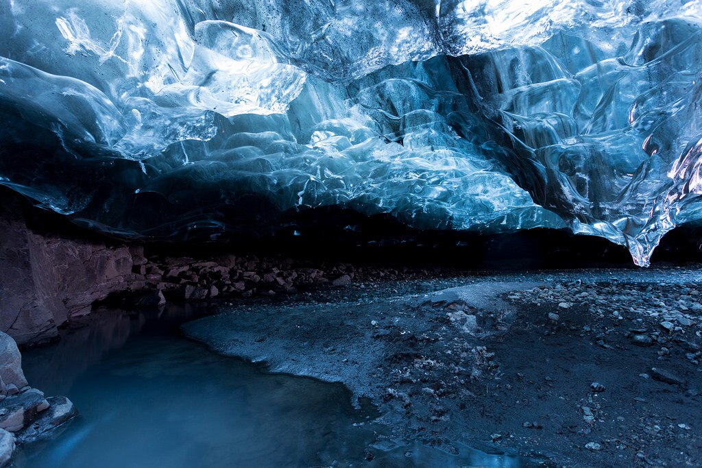 Ice caving under the Vatnajökull Glacier, Iceland | by _davidphan (https://c1.staticflickr.com/9/8633/16499397137_51fe418164_b.jpg)