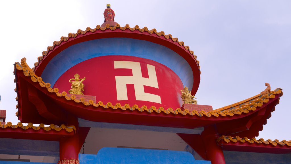 Statue of Guanyin featuring a temple or place of worship and religious elements