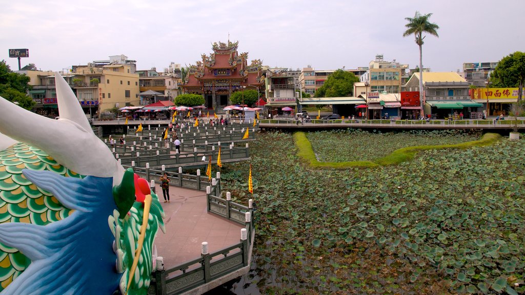 Dragon Tiger Tower featuring a pond