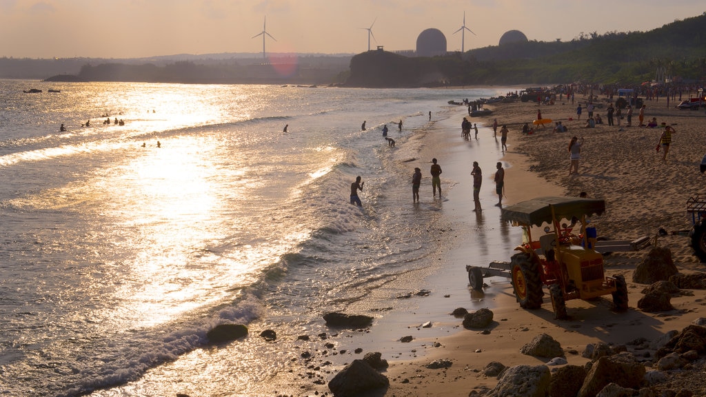 Nan Wan Beach which includes a sandy beach and a sunset