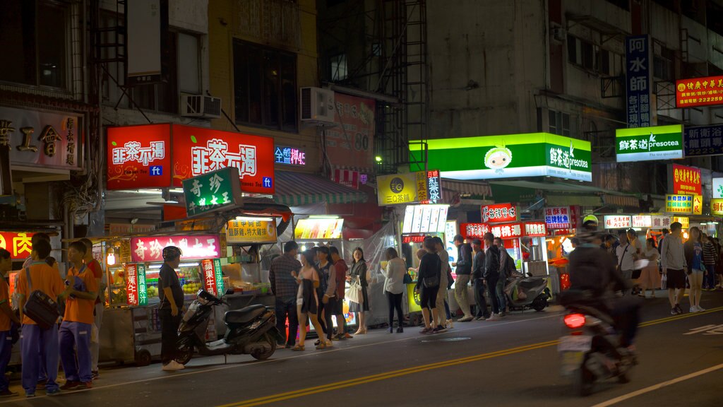 Mercado nocturno Zhonghua que incluye escenas nocturnas, mercados y una ciudad