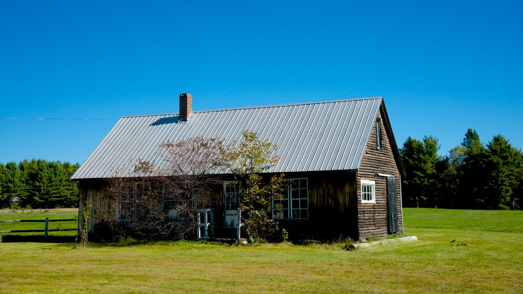 Solon som visar ett hus och åkrar