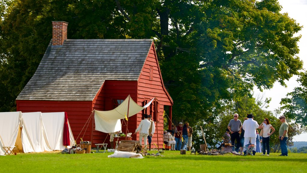 Saratoga National Historical Park showing tranquil scenes and heritage architecture as well as a small group of people