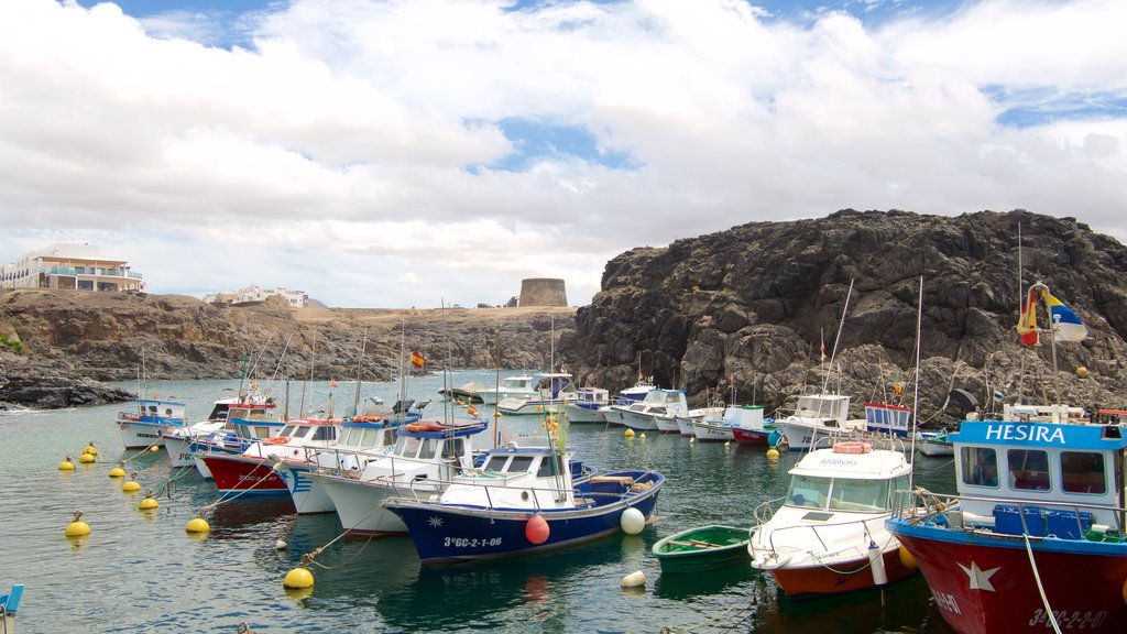 El Cotillo featuring a bay or harbour, rugged coastline and boating