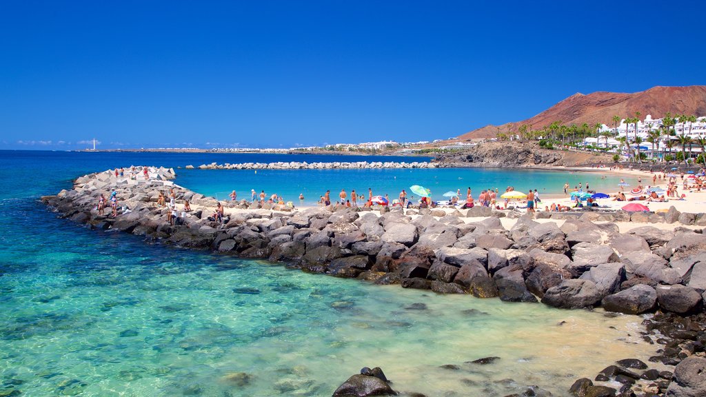 Playa Blanca showing general coastal views and a sandy beach