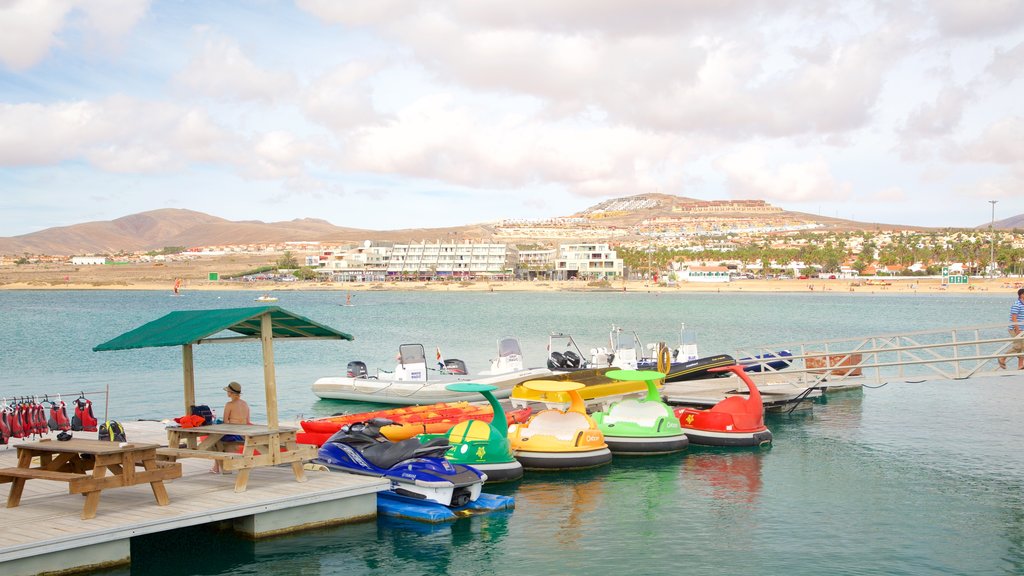 Caleta de Fuste featuring a bay or harbor, boating and general coastal views