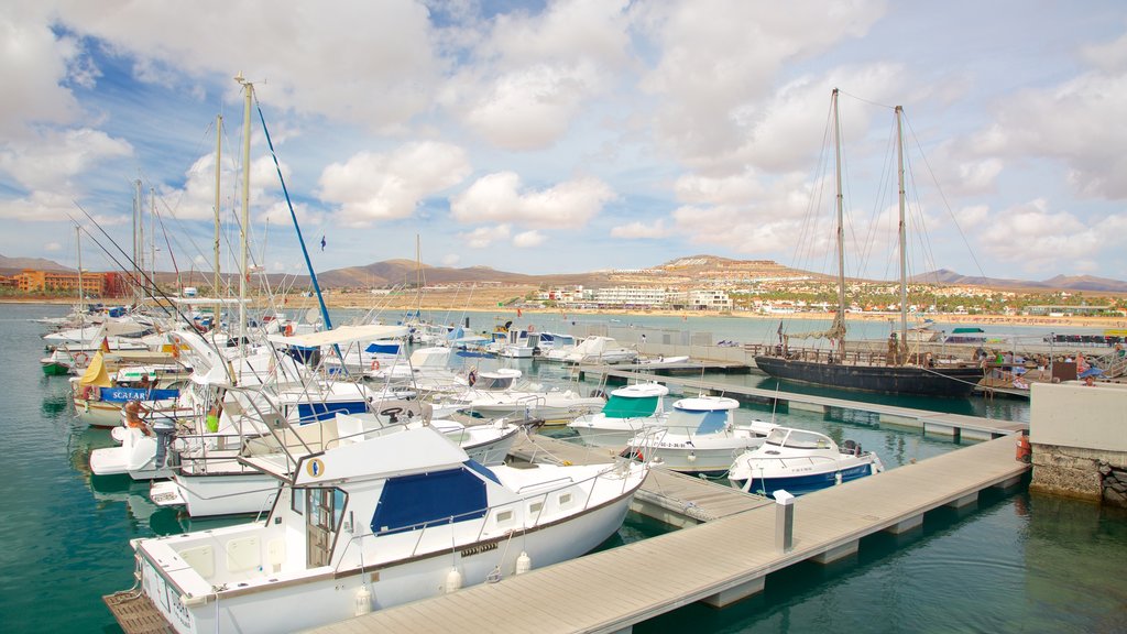 Caleta de Fuste featuring a bay or harbour and boating