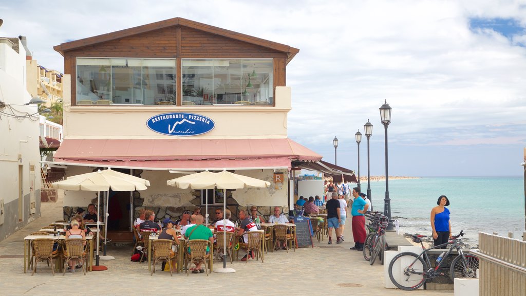 Morro Jable showing general coastal views and outdoor eating