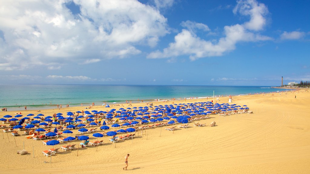 Meloneras que inclui uma praia e paisagens litorâneas